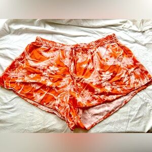 H&M ladies tropical leaf short on Coral color. Size X Large.